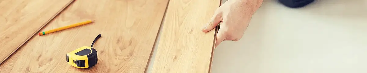 A professional installing wood flooring in Allentown, PA