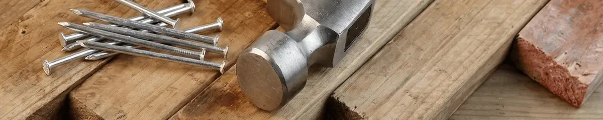 Hammer and nails on hardwood flooring boards in Allentown, PA