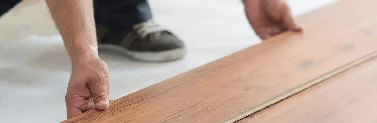 A professional installing laminate flooring in Allentown, PA
