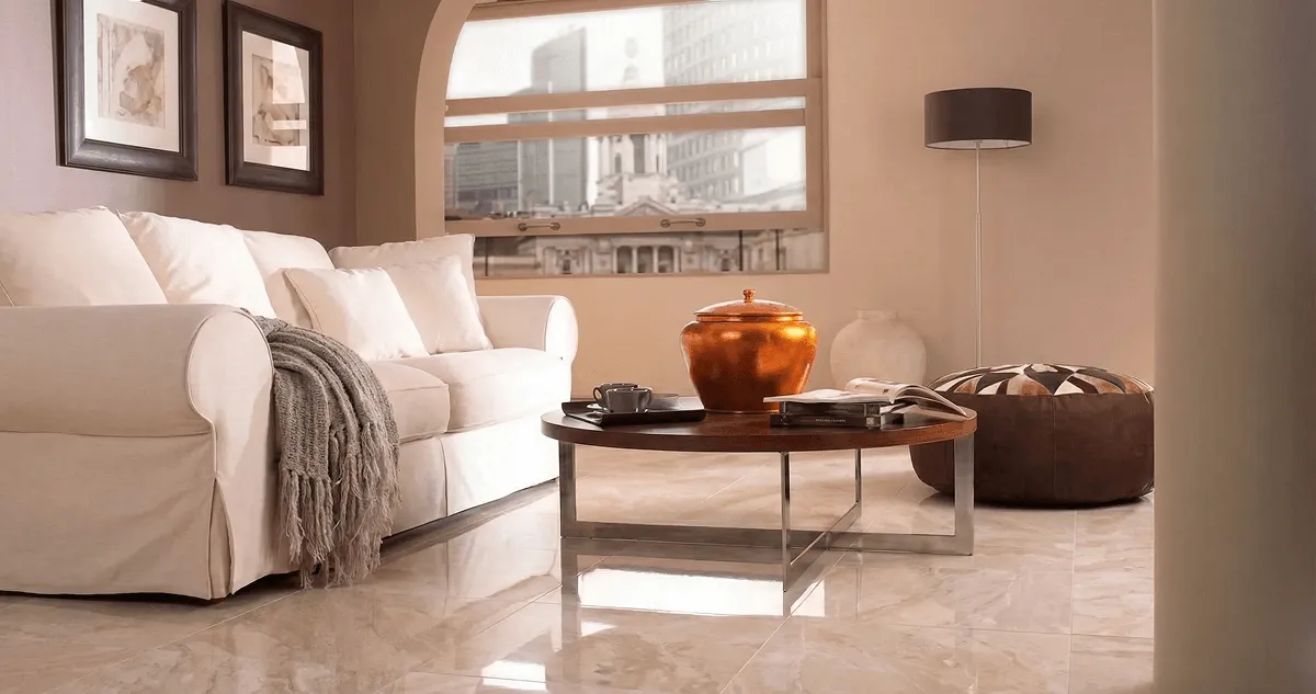 Modern living room with professionally installed marble flooring, a beige sofa, coffee table in Allentown, PA