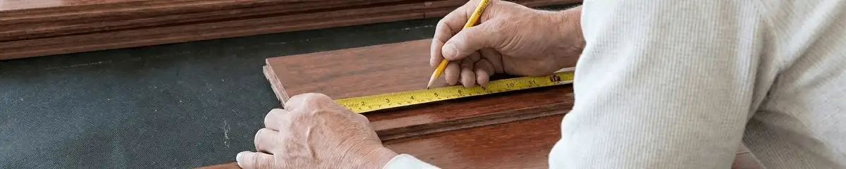 A professional installing wood flooring in Allentown, PA